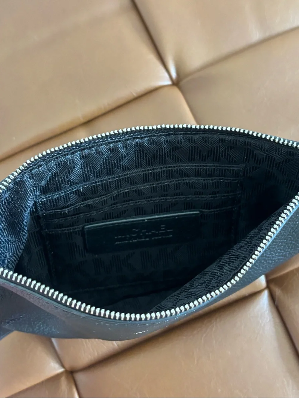 Michael Kors Black Pebbled Leather pouch with Silver Accents